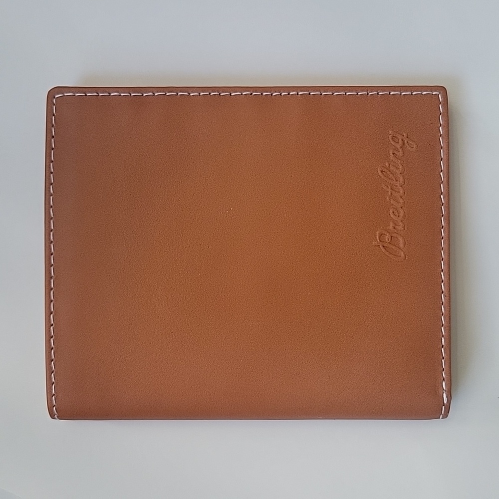 Breitling men's leather wallet with slots for 11 credit cards, snap coin holder.